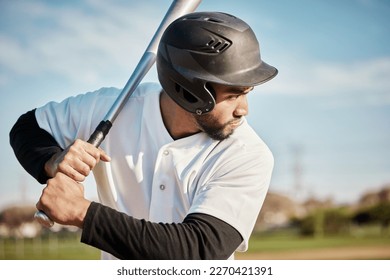 Baseball, bat and serious with a sports man outdoor, playing a competitive game during summer. Fitness, health and exercise with a male athlete or player training on a field for sport or recreation - Powered by Shutterstock