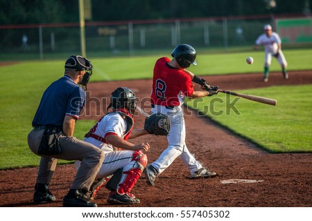 Baseball batter hits the ball