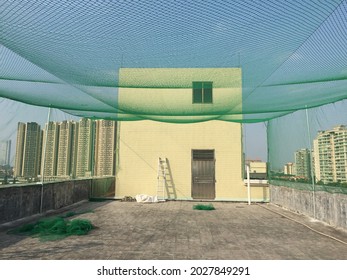 Baseball Batting Cage On The Top Of Building.