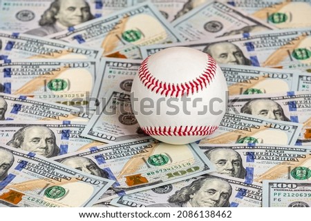 Baseball with cash money. Major league strike, lockout and sports betting concept.