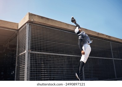 Baseball, catch and sports man in match on field of stadium for training, practice or workout. Fitness, air or agile athlete playing game in park for outdoor competition, exercise or jumping in air - Powered by Shutterstock