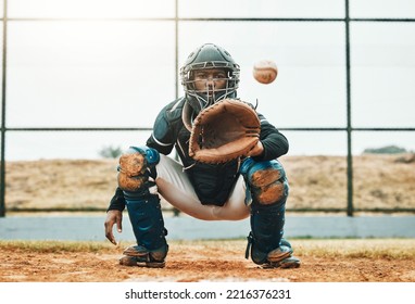 Baseball, catch and sports at the pitch for game, point or score with the ball on a field in the outdoors. Black man pitcher with mitt in sport training, exercise and fitness in competitive match - Powered by Shutterstock