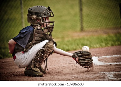 Baseball Catcher with Ball in Action