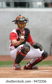 Baseball Catcher In Red Pinstripe Uniform