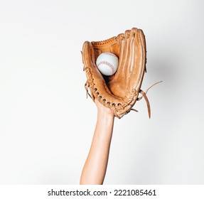 Baseball is caught in worn baseball glove. - Shutterstock ID 2221085461