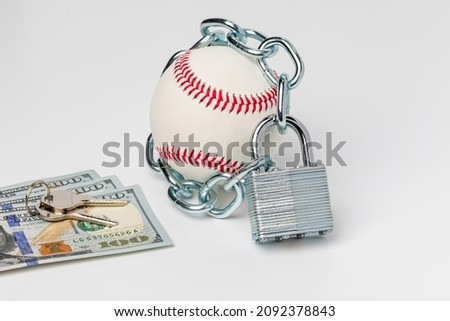 Baseball with chain and lock. Baseball strike, lockout and labor disagreement concept.