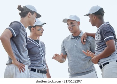 Baseball coach from below giving match pep talk and planning game strategy with group of players in huddle on sports pitch outside. Trainer encouraging and motivating team for tournament competition - Powered by Shutterstock