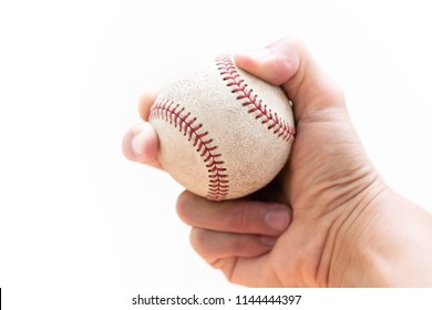 Baseball : Curveball Grip With Two Fingers And Seams - Close Up On A White Background With Copy Space.
