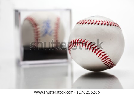 Baseball With Display Case Autographed Memorabilia Blurred In Background Isolated On White