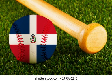 Baseball With Dominican Republic Flag And Bat Over A Background Of Green Grass