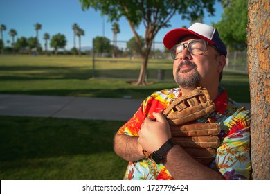 Baseball Fan Wearing Baseball Glove At A Baseball Park