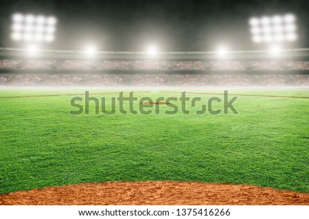 Baseball field at brightly lit outdoor stadium. Focus on foreground and shallow depth of field on background and copy space.