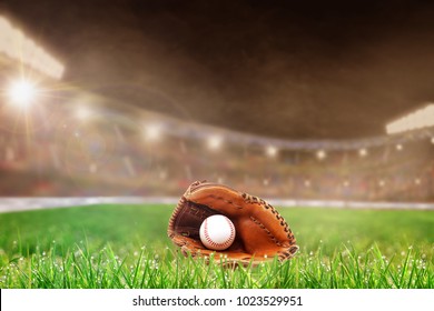 Baseball glove and ball on grass in brightly lit outdoor stadium with focus on foreground and shallow depth of field on background. Deliberate lens flare and copy space.