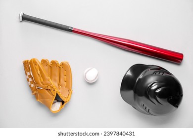 Baseball glove, bat, ball and batting helmet on light grey background, flat lay - Powered by Shutterstock