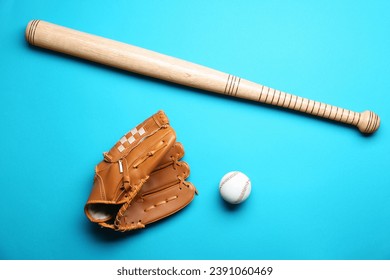 Baseball glove, bat and ball on light blue background, flat lay - Powered by Shutterstock