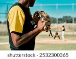 Baseball, hands and mit of pitcher on field for start of competition, game or tournament from back. Exercise, fitness and team sports with athlete or player at venue for competition or challenge