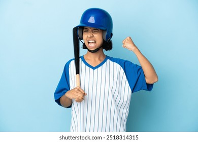 Baseball mixed race player woman with helmet and bat isolated on blue background doing strong gesture - Powered by Shutterstock