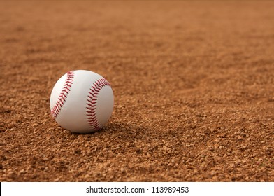 Baseball On The Infield Dirt With Room For Copy