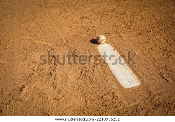Baseball on pitcher\'s mound\
of field