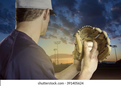 Baseball pitcher ready to pitch in an evening baseball game