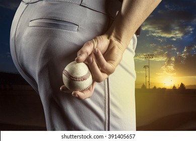 Baseball pitcher ready to pitch in an evening baseball game