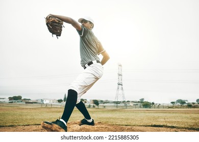 Baseball, Pitcher And Sports, Athlete Man And Throw A Pitch During A Competitive Game Or Match On A Court. Fitness, Workout And Exercise With A Pro Male Player Training Or Practice Outdoor On Field