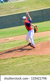 Baseball pitcher throwing the ball.