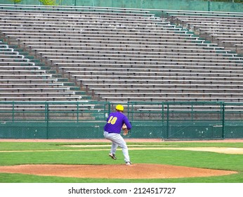 Baseball Pitcher winding up before Empty Stands - Powered by Shutterstock