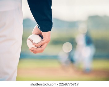 Baseball player, ball and athlete or pitcher hand in a competitive match or game on the sports field for training. Closeup, sportsman and person playing a sport or softball as exercise and fitness
