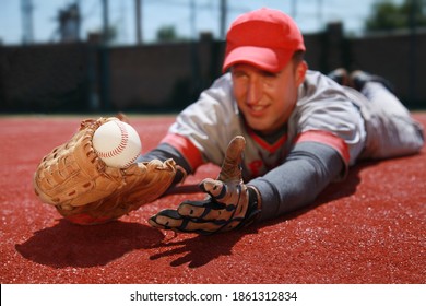 Baseball Player Diving To Catch The Ball