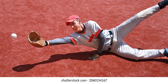 Baseball Player Diving to Catch the Ball