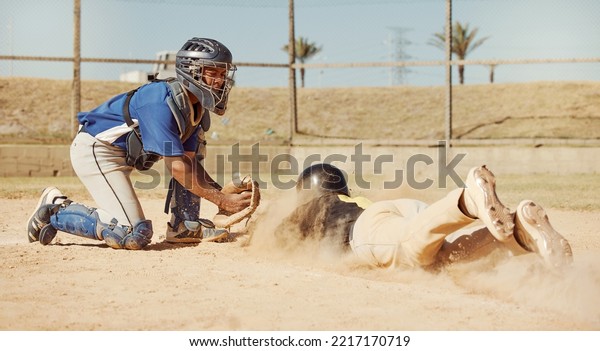 Baseball, baseball player and diving on home plate\
sand of field ground sports pitch on athletic sports ball game\
competition. Softball match, sport training and fitness workout in\
Dallas Texas dust