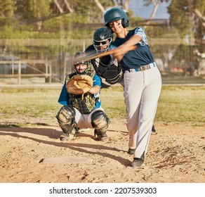 Baseball player, female athlete and swinging bat with sports technique or skill while playing a competitive game or match on a pitch or field. Fit female with a catcher doing exercise and recreation - Powered by Shutterstock