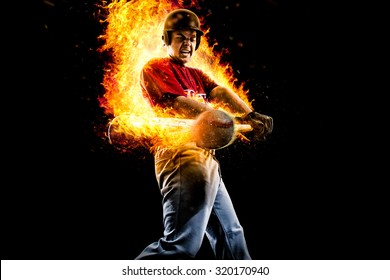 baseball player in fire hit a flying ball. isolated on black background