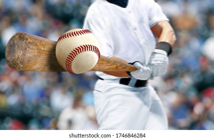 Baseball player hitting ball with bat in close up  - Shutterstock ID 1746846284