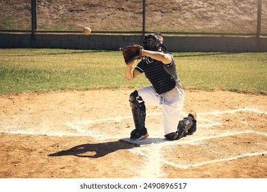 Baseball player, man and catcher with glove in game on field in helmet, safety or contest. Person, sports and ready for pitcher, training and workout for competition, fast ball and fitness in summer - Powered by Shutterstock