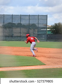 Baseball Player Running To Steal Second Base 