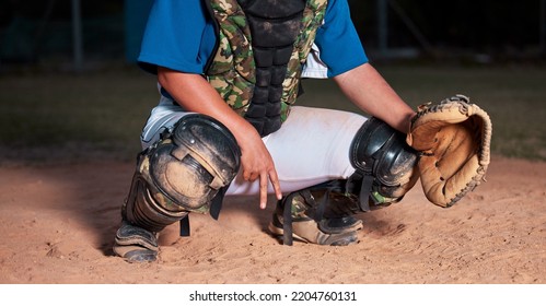 Baseball, player and sign of a sports hand gesture or signals for game strategy showing curveball on a pitch. Catcher holding ball glove in sport secret for team communication during match at night