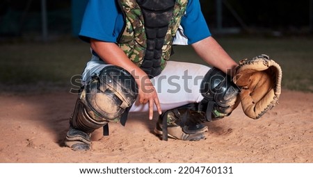 Baseball, player and sign of a sports hand gesture or signals for game strategy showing curveball on a pitch. Catcher holding ball glove in sport secret for team communication during match at night