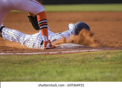 Baseball Player Sliding First Base