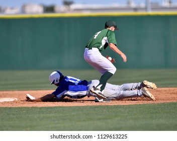 Baseball player sliding into base - Powered by Shutterstock