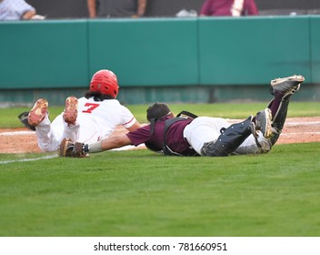 Baseball Player Sliding into Base