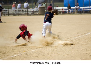 Baseball Player Sliding Into Third Base