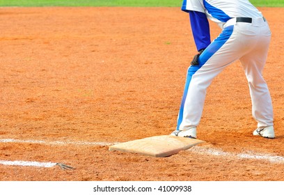 a baseball player step on the bag - Powered by Shutterstock