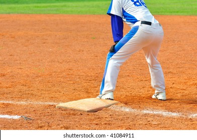 a baseball player step on the base - Powered by Shutterstock