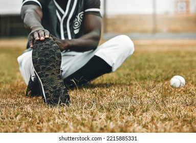 Baseball player, stretching legs and athlete black man on sports field doing warm up exercise, workout and practice for match. Fitness male touch feet for health, wellness and energy on outdoor pitch - Powered by Shutterstock