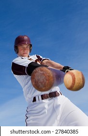 A Baseball Player Taking A Swing At A Baseball