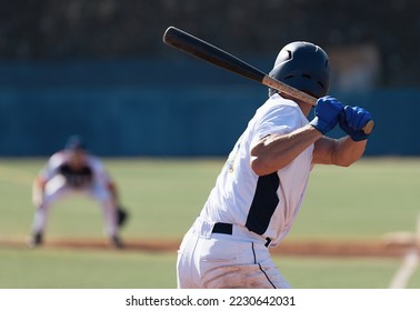 Baseball players in action on the stadium, baseball batter waiting to strike the ball - Shutterstock ID 2230642031
