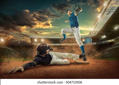 Baseball Players In Action On The Stadium.