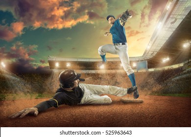 Baseball Players In Action On The Stadium.